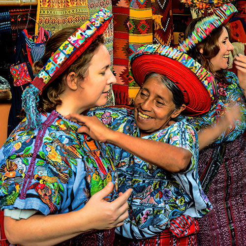 Happy travelers enjoying the cultural immersion at Lake Atitlan