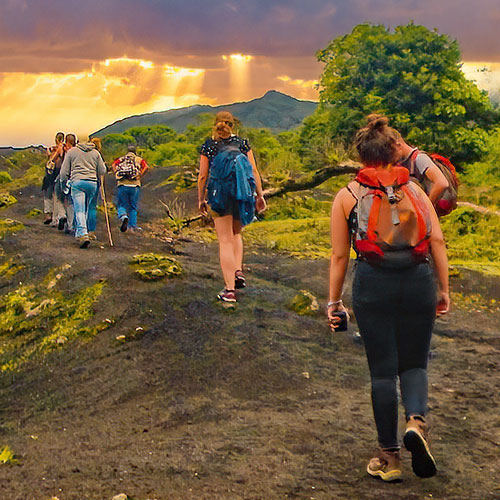 Hiking volcano adventure of a group of young traveleres