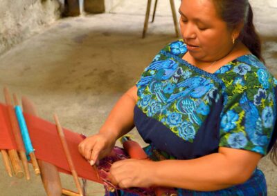 A Mayan weaver using the backstrap Loom during our cultural immersion in Antigua, Guatemala.