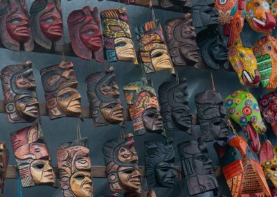 Wooden masks from Chichicastenango Market photographed during a Guatemala Market tour.